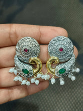 Dual-tone peacock-motif stud earrings