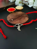 Silver Look Ram Rakhi with Bow Accent | AMOLA