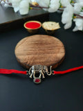 Elephant Charm Silver Rakhi with Red Stone | AMOLA