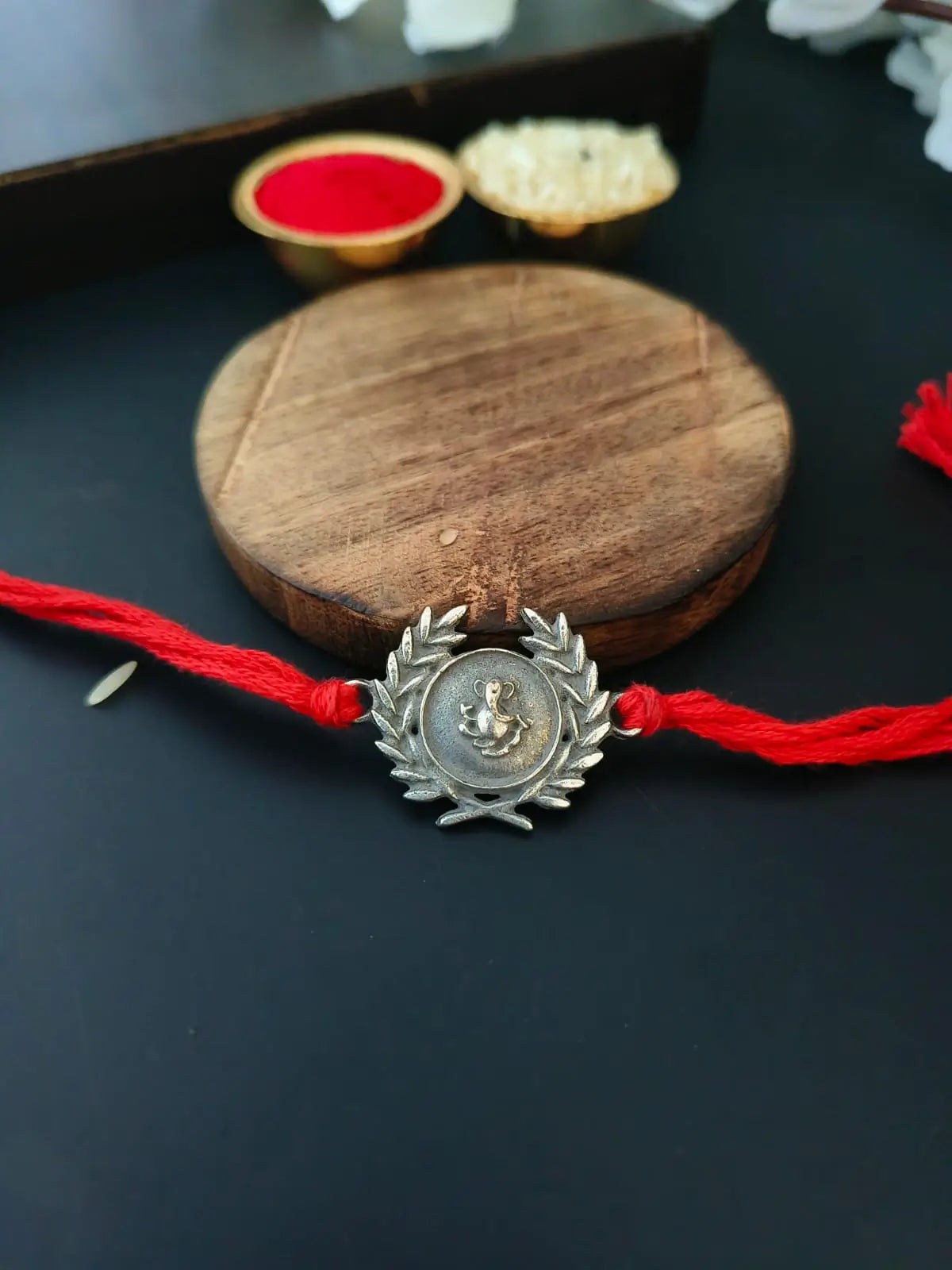 Ganesha Leaf Rakhi in Silver Shine | AMOLA