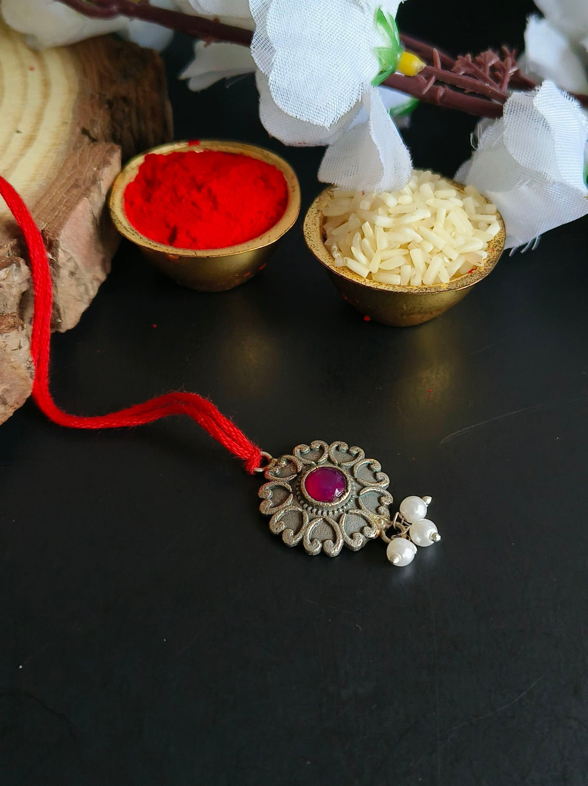 Floral Charm Lumba Rakhi with Red Stone Drop | AMOLA