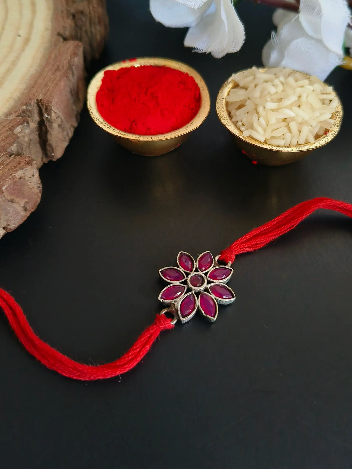 Elegant Ruby Floral Rakhi Charm | AMOLA