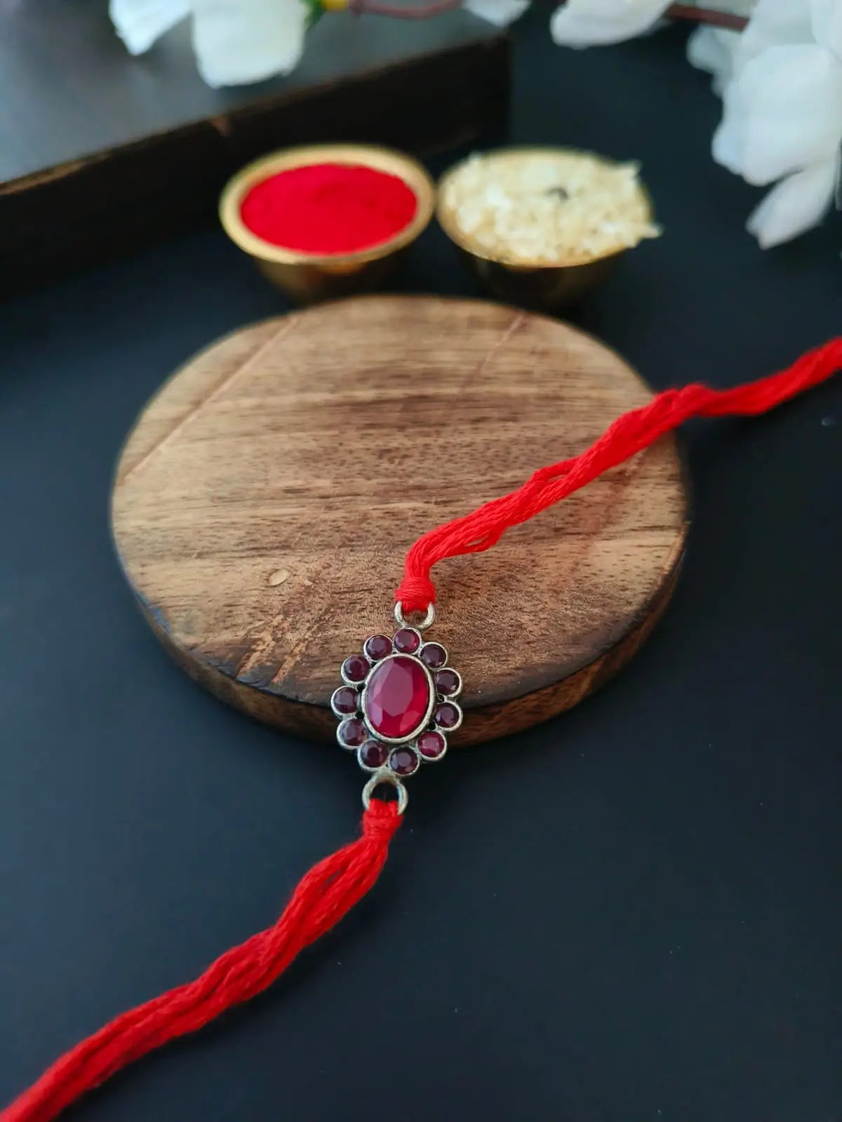 Red Stone Oval Rakhi in Silver Finish | AMOLA
