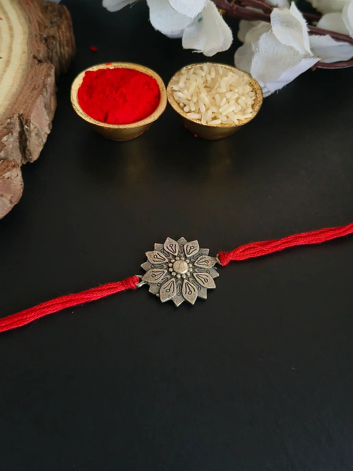 Antique Floral Charm Rakhi in Oxidised Finish | AMOLA